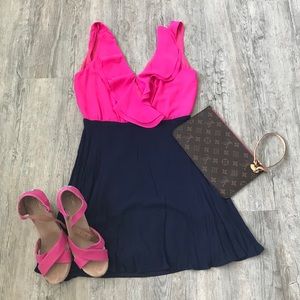 Pink and navy dress with ruffle top detail.